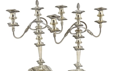 A pair of George VI silver two branch three light candelabra...