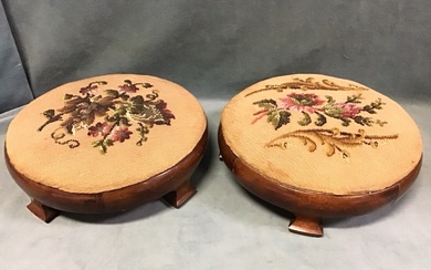 A pair of Victorian mahogany footstools with circular upholstered drop-in...