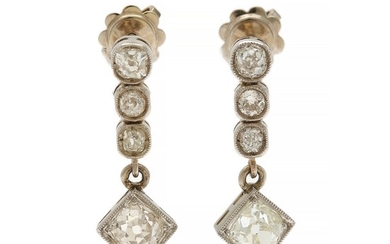 A pair of diamond ear pendants each set four old-cut diamonds totalling app. 2.30 ct., mounted in platinum. L. app. 2.3 cm. (2)