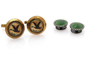 SOLD. A pair of enamel studs each set with green and white enamel, mounted in sterling silver. Accompanied by a pair of gilded cuff links. (4) – Bruun Rasmussen Auctioneers of Fine Art