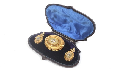 A pair of mid Victorian gold and half-pearl oval pendent earrings and a matching brooch.