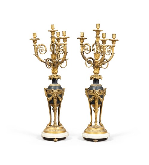 A pair of patinated bronze and gilt bronze candelabra, Louis XVI style, late 19th century | Paire de candélabres en bronze patiné et bronze doré de style Louis XVI, fin du XIXe siècle