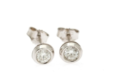 A pair of solitaire ear studs each set with a brilliant-cut diamond totalling app. 0.47 ct., mounted in 18k white gold. (2)
