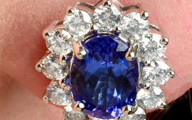 A pair of tanzanite and brilliant-cut diamond cluster earrings.
