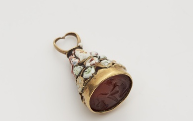 A possibly French gold and enamel breloque with an ancient Roman carnelian intaglio. Within it's original case.