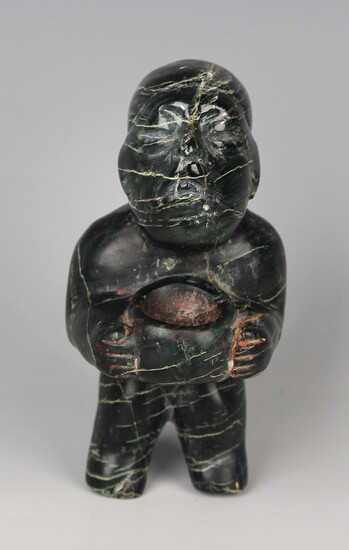 A pre-Columbian Olmec style carved variegated dark green hardstone stargazer figure, probably 900-45