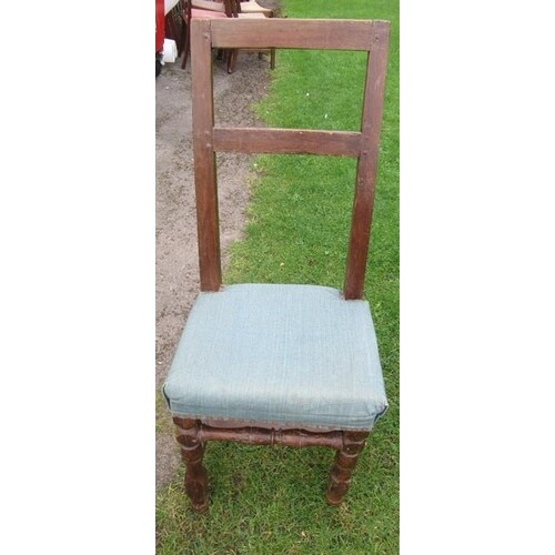 A primitive chair, with upholstered seat and turned front le...