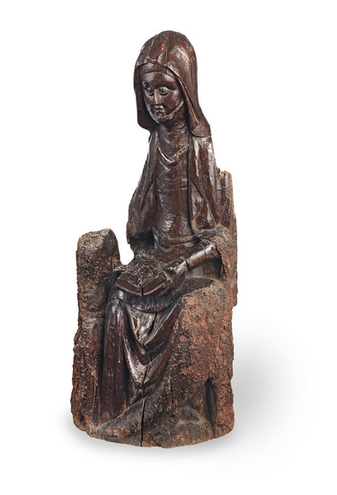 A rare 15th/early 16th century carved walnut figure, French, Saint Anne Teaching the Virgin to Read