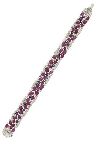 A ruby, sapphire and diamond bracelet, the openwork...
