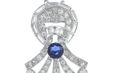 A sapphire and vari-cut diamond pendant, suspended from