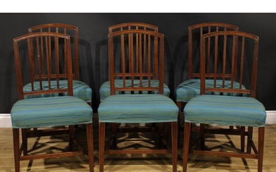 A set of six George III mahogany dining chairs, each arched ...