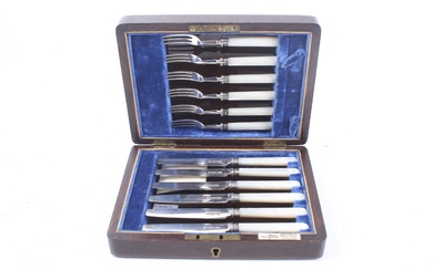 A set of six silver and mother of pearl handled tea knives.