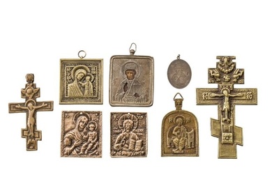 A small Russian icon showing Saint Nicholas of Myra with silver oklad, a silver pendant showing