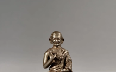 A small inscribed silver figure of Sangye Nyenpa, Tibet, 16th century
