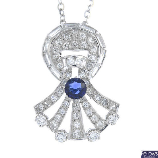 A vari-cut sapphire and diamond pendant, with chain.