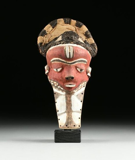 AN AFRICAN RED PAINTED MASK, PROBABLY BAULE PEOPLE