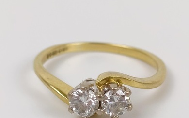 An 18ct gold and two stone diamond crossover ring, ring size...