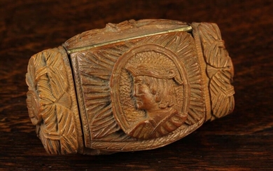 An 18th Century Carved Coquilla Nut Snuff Box. The hinged rectangular cushion-moulded lid carved wit