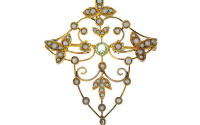 An Edwardian 9ct gold peridot and seed pearl openwork foliate pendant/brooch.