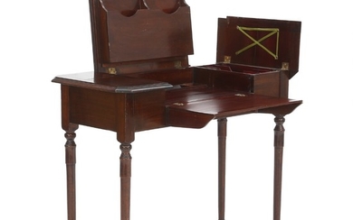 An Edwardian mahogany travel desk. 'The Britisher Desk Company'. England, ca. 1910. H. 76 cm. W. 90 cm. D. 44 cm.