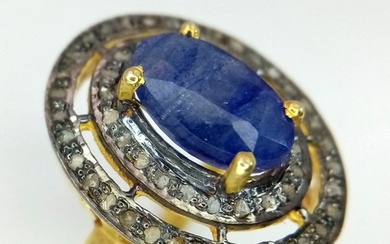 An Edwardian silver and gold overlay ring with an oval cut s...