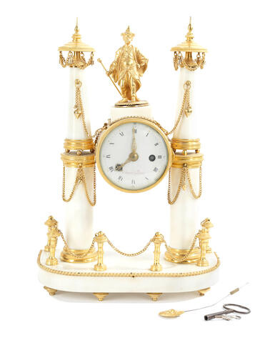 An early 19th century gilt bronze and white marble figural portico clock