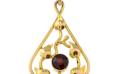 An early 20th century gold garnet foliate pendant.