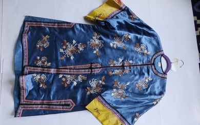 An early 20thC Chinese blue silk embroidered robe, decorated...