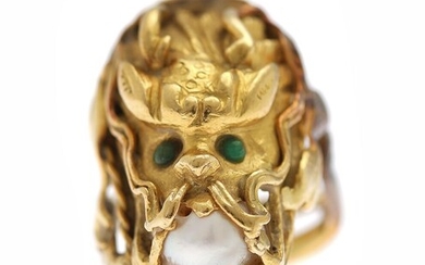 SOLD. An emerald and pearl ring in the shape of a dragons head set with...