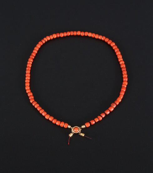 Antique red coral necklace with gold lock.
