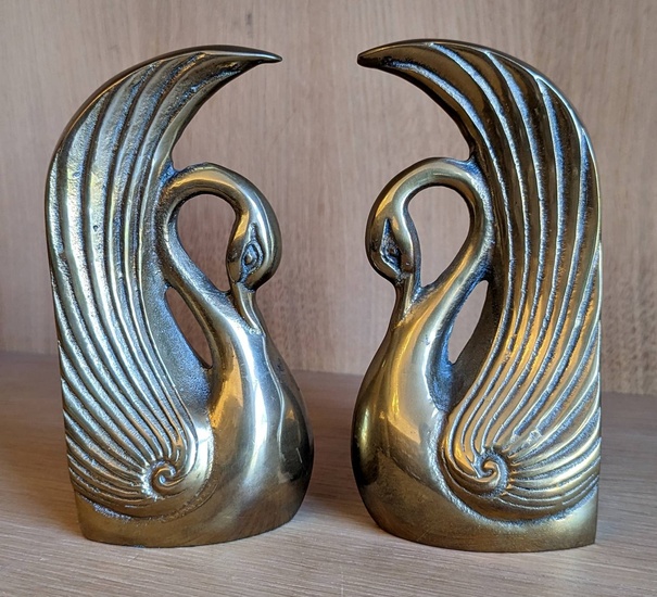 [Bookends]. A pair of swan bookends, brass, partly polished, both...