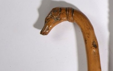Boxwood cane with a handle representing a dog's...