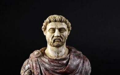 Bust of a Roman emperor, composite, the bust draped in antique breccia violet marble, the head in ivory carved in the style of ancient ivories (restoration at the back), the pedestal in white marble brought back.