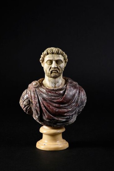 Bust of a Roman emperor, composite, the bust draped in antique breccia violet marble, the head in ivory carved in the style of ancient ivories (restoration at the back), the pedestal in white marble brought back.