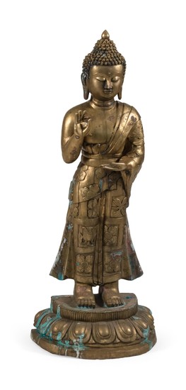 CHINESE BRONZE FIGURE OF STANDING BUDDHA With a tightly curled top knot and flowing robes. Height 45.5".