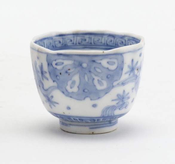 CHINESE UNDERGLAZE BLUE AND WHITE PORCELAIN WINE CUP Exterior with sand dollar and floral mon decoration and interior with deer. Key...