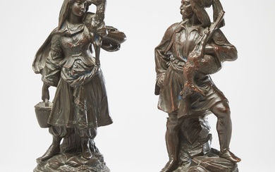 COUPLE DE STATUETTES DE JEUNES GRECS en terre cuite patinée à l'imitation du bronze, figurés...