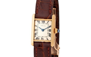 Cartier. Very Attractive Mini-Tank Rectangular-Shape Wristwatch in Yellow Gold, Silver Dial and Black Roman Numbers