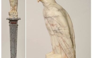Carved alabaster "Eagle" resting on a grey and...
