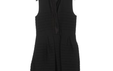 Céline: A black sleeveless dress with textured stripes, two pockets, high neckline with collar and a button. Size 40 (FR)