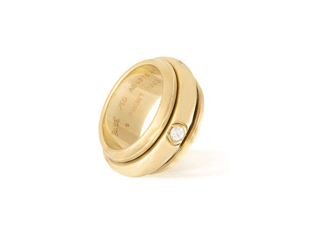 Description A GOLD AND DIAMOND "POSSESSION" RING, BY PIAGET,...