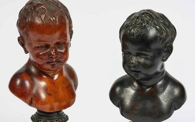 Due busti di fanciullo in legno scolpito e bronzo fuso.