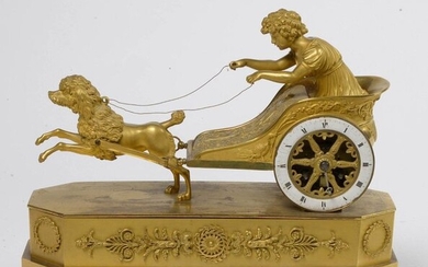 Empire style clock known as the "Children's Chariot" in chased gilt bronze. French work. Period: early 19th century. Thread movement. (* on the dial, hands and balance missing). Dim.:+/-36x30,5x12cm.