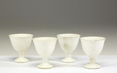 Four Chinese white-glazed pottery stem cups