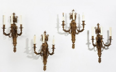 Four Louis XVI style gilt bronze wall lights