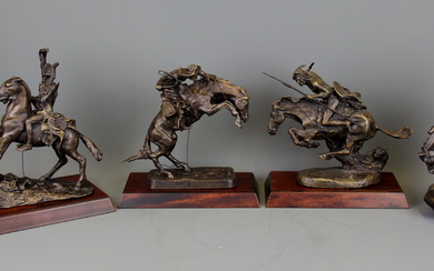 Four bronze Indian and Cowboy figurines issued by The Frederick Remington Art Museum, tallest H. 20cm.