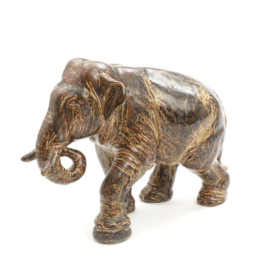 SOLD. Karl Larsen: A Royal Copenhagen stoneware elephant. Signed with monogram KL, 20893, 12/15. H. 35 cm. – Bruun Rasmussen Auctioneers of Fine Art