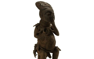 Large African Carved Wood and Tusk Mounted Male Figure.