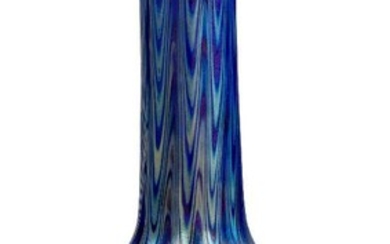 Loetz (Austrian), an iridescent Phaenomen lobed solifleur glass vase, c.1898, PG 6893, ground out pontil, The dark blue body decorated with silver and blue iridescent pulled threads and bands, 17.5 cm high Provenance John Jesse c. 1989, Property...