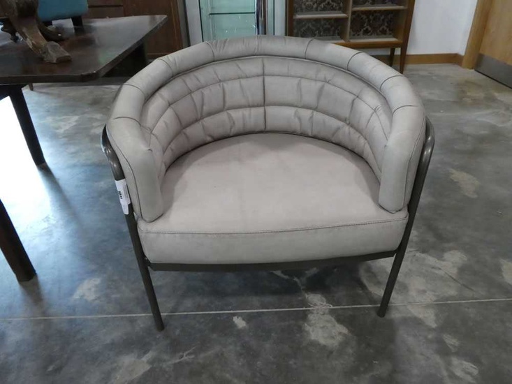 Modern metal framed tub shaped easy chair in faux leather...